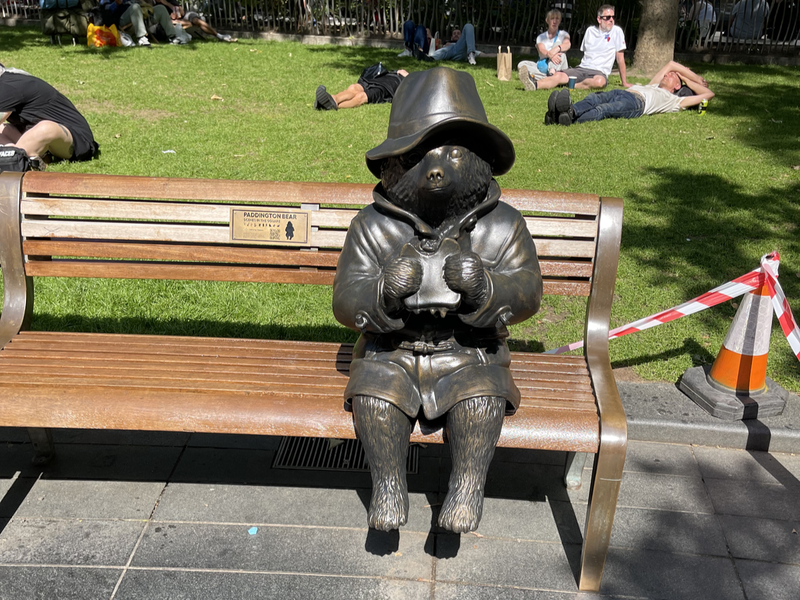 Paddington Bear eating a sandwich